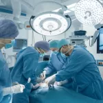 Medical Team Performing Surgical Operation in Bright Modern Operating Room