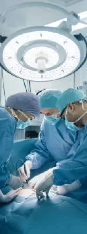 Medical Team Performing Surgical Operation in Bright Modern Operating Room